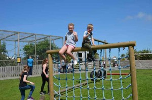 Kids playing on climbing frame